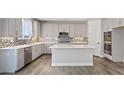 Spacious kitchen featuring stainless steel appliances, white countertops and patterned backsplash at 10058 Matter Overlook Dr, Las Vegas, NV 89178