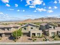 Stylish two-story home boasts desert landscaping and mountain views at 12415 Notch Trail Ave, Las Vegas, NV 89138
