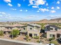 Stylish two-story home boasts desert landscaping and mountain views at 12415 Notch Trail Ave, Las Vegas, NV 89138