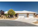 Charming single-story home with well-maintained landscaping and a three-car garage at 231 Bristle Cone, Pahrump, NV 89048