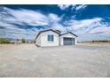 Beautiful modern home with gray accents and low maintenance desert landscaping at 2461 S Blagg Rd, Pahrump, NV 89048