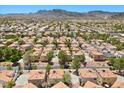 Panoramic aerial view of a residential community with mountain views in the distance at 3340 Epson St, Las Vegas, NV 89129