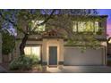 Charming two-story home featuring desert landscaping and an attached two-car garage at 3340 Epson St, Las Vegas, NV 89129