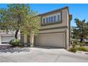 Charming two-story home with a driveway leading to a two-car attached garage at 3340 Epson St, Las Vegas, NV 89129