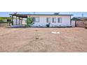 Exterior view of a cozy single story home with desert landscaping at 335 W Basic Rd, Henderson, NV 89015