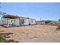 Single story home featuring desert landscaping at 335 W Basic Rd, Henderson, NV 89015