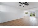 Spacious living area with light wood floors, recessed lighting, and large windows for ample natural light at 343 W Basic Rd, Henderson, NV 89015