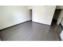 A cozy bedroom with sleek wood-look tile floors and ample natural light at 3453 Del Marino Dr, Las Vegas, NV 89121