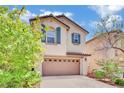 Charming two-story home featuring a well-manicured lawn, a two-car garage, and decorative shutters at 3741 Via Gaetano, Henderson, NV 89052