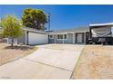 Charming single-story home with a well-maintained front yard and an RV hookup at 4492 Rita Dr, Las Vegas, NV 89121