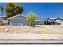 Exterior of a charming single-story home with desert landscaping at 4492 Rita Dr, Las Vegas, NV 89121