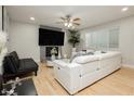 Cozy living room with modern furnishings, a fireplace, and ample natural light at 4492 Rita Dr, Las Vegas, NV 89121