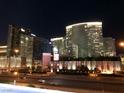 Night shot of a city skyline featuring modern buildings and brightly lit streets at 4575 Dean Martin Dr # 303, Las Vegas, NV 89103