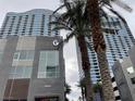 Low angle of a modern condo building with surrounding tropical palm trees at 4575 Dean Martin Dr # 705, Las Vegas, NV 89103
