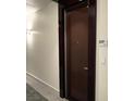 Condo hallway featuring unit 705 and a dark wood door at 4575 Dean Martin Dr # 705, Las Vegas, NV 89103