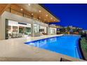 Beautiful backyard with a pool and hot tub, perfect for entertaining at 49 Crested Cloud Way, Las Vegas, NV 89135