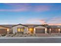 Charming single-story home features a neutral color palette, drought-resistant landscaping, and a two-car garage at 5081 Notting Hill Ave, Las Vegas, NV 89139