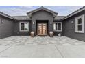Elegant entryway features modern doors, clean lines, and neutral color palettes at 6235 N Fort Apache Rd, Las Vegas, NV 89149