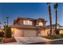 Attractive two-story home with a three-car garage and drought-tolerant landscaping at 9583 Gainey Ranch Ave, Las Vegas, NV 89147