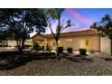 The backyard offers a serene patio area, desert landscaping, and a well-maintained exterior at 1900 Bellview St, Las Vegas, NV 89134