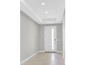 Welcoming foyer with tiled floors, neutral walls, and a modern front door with glass panel at 2170 Monte Bianco Pl, Henderson, NV 89044