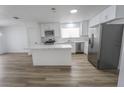 Bright, updated kitchen with stainless steel appliances, white cabinets, and a large island at 4269 Roanridge Ave, Las Vegas, NV 89120