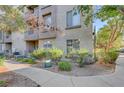 Exterior shot of condo building with fresh landscaping and mature shade trees at 4400 S Jones Blvd # 1125, Las Vegas, NV 89103