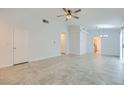 Spacious living room with vaulted ceilings, neutral tile flooring, and ample natural light at 5425 Comchec Way # 103, Las Vegas, NV 89108