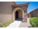 Charming front porch featuring stone accents and a welcoming entrance with an ADT security sign at 7252 Blowing Breeze Ave, Las Vegas, NV 89179