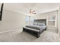 Large main bedroom with a ceiling fan, neutral carpet, and plenty of natural light at 8937 Pelican Point St, Las Vegas, NV 89178