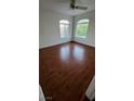 Cozy bedroom with ample natural light and rich hardwood floors for a warm and inviting atmosphere at 3930 Starfield Ln, Las Vegas, NV 89147