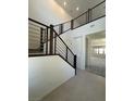 Stylish staircase features modern horizontal railings and leads to a bright, open living space at 560 Preston Oak Pl, Las Vegas, NV 89138