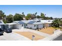 An elevated view of a charming single-story home with a carport and modern solar panels at 6236 Foothill Blvd, Las Vegas, NV 89118