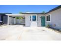 This home has a covered carport, a modern front door, and efficient solar panels at 6236 Foothill Blvd, Las Vegas, NV 89118
