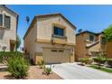 Inviting two-story home with a two-car garage, cozy balcony and easy care landscaping at 6548 Butterfly Sky St, North Las Vegas, NV 89084