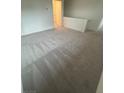 Upstairs carpeted loft space with neutral colors, offering versatility as a play area or second living space at 6604 Bowery St, Las Vegas, NV 89148
