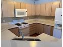 Bright and modern kitchen with clean countertops and light wood cabinets at 7905 Ryandale Cir # 201, Las Vegas, NV 89145