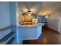 Open-concept kitchen features a breakfast bar, modern appliances, and ample counter space at 7905 Ryandale Cir # 201, Las Vegas, NV 89145