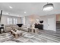 Spacious living room with a comfy sectional, modern decor, and plenty of natural light at 108 Parker Ranch Dr, Henderson, NV 89012