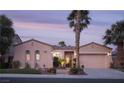 Inviting single-story home with desert landscaping, a tile roof, and a convenient two-car garage at 2824 Evening Rock St, Las Vegas, NV 89135
