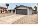 Charming single-story home featuring a two-car garage, arched windows, and low-maintenance gravel landscaping at 4416 Rip Van Winkle Ln, Las Vegas, NV 89102