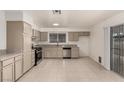 Spacious kitchen with granite countertops, stainless steel appliances, and neutral-colored cabinets at 4416 Rip Van Winkle Ln, Las Vegas, NV 89102
