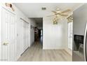 Hallway with hardwood floors, white walls, and doors with gold hardware at 4908 Winterset Dr, Las Vegas, NV 89130