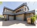 Impressive modern home showcasing a three-car garage and stone accents at 6 Yorkridge Ct, Henderson, NV 89052