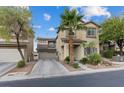 Charming two-story home with desert landscaping, attached two-car garage, and covered entryway at 8325 Winterchase Pl, Las Vegas, NV 89143