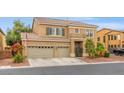 Inviting two-story home with a three-car garage, mature landscaping, and charming curb appeal at 8929 Monte Oro Dr, Las Vegas, NV 89131