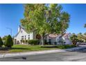 Charming single-story home with manicured lawn, mature shade trees, and a two-car garage at 9201 Yucca Blossom Dr, Las Vegas, NV 89134