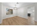 Bright dining area featuring wood floors, decorative window and a stylish chandelier at , Las Vegas, NV 89103