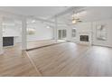 Open concept living room with a fireplace, wood floors and lots of natural light at , Las Vegas, NV 89103