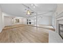 Spacious open concept living room featuring wood floors, lots of natural light and a fireplace at , Las Vegas, NV 89103
